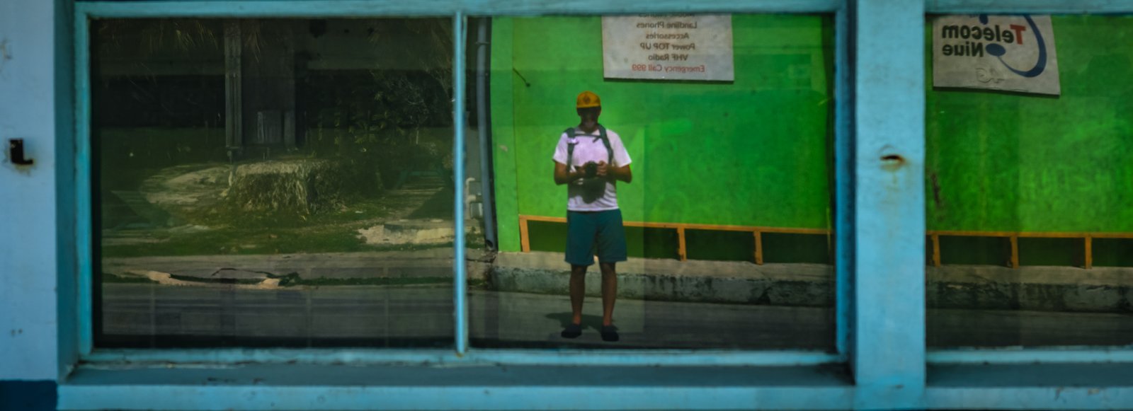 Self portrait in the Telecom Niue window